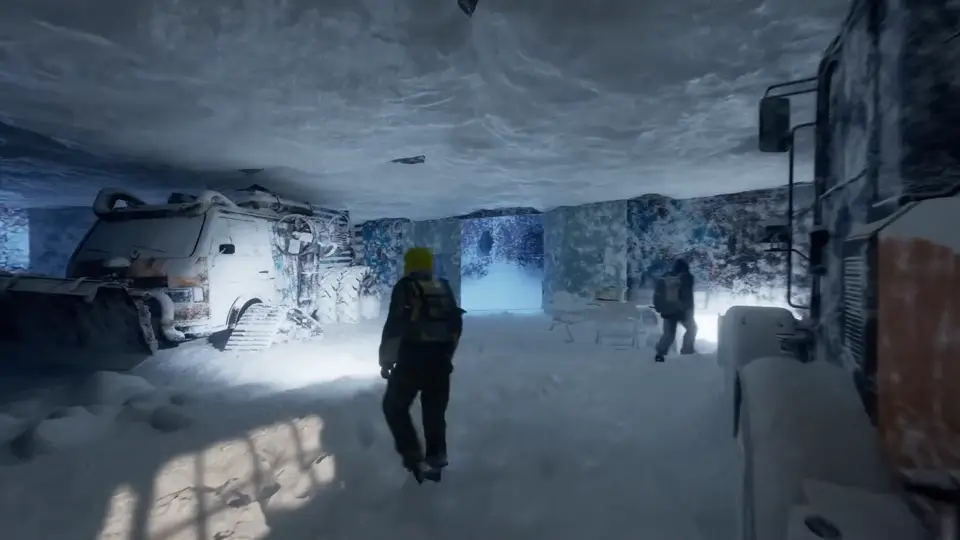 Two survivors walk through a snowbound tunnel past buried vehicles.